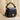 Profile shot of Mini Palais Royal Crown black leather mini bag with silver accents
