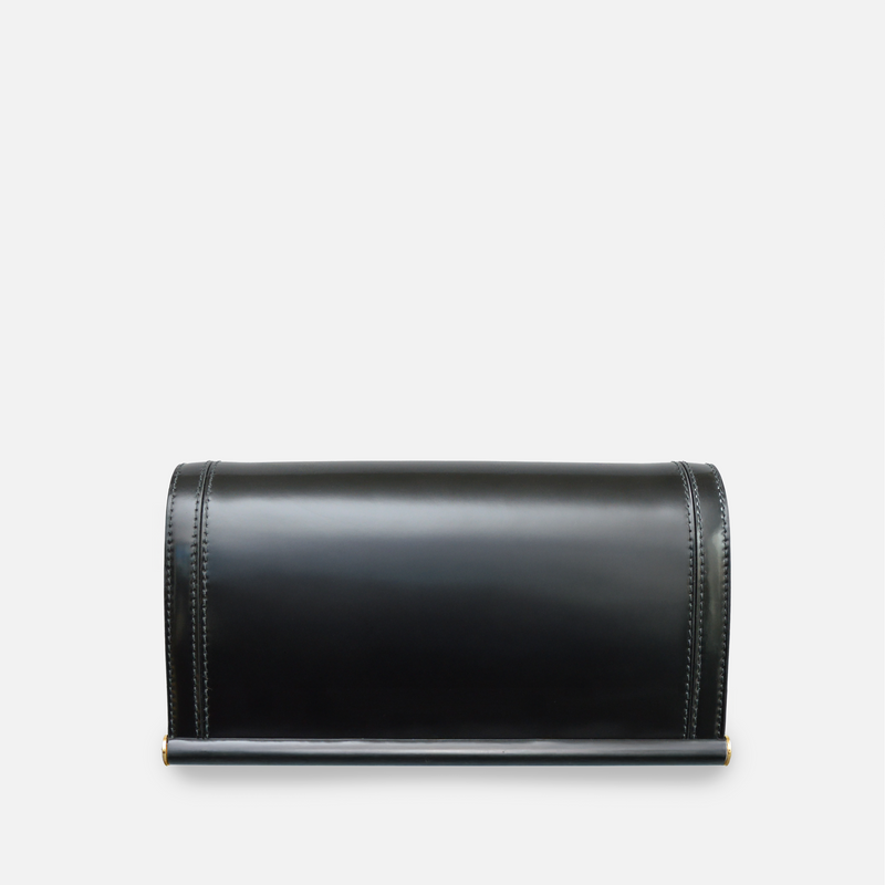 Black leather clutch bag with a sculptural silhouette – Temple by Susan Szatmáry.