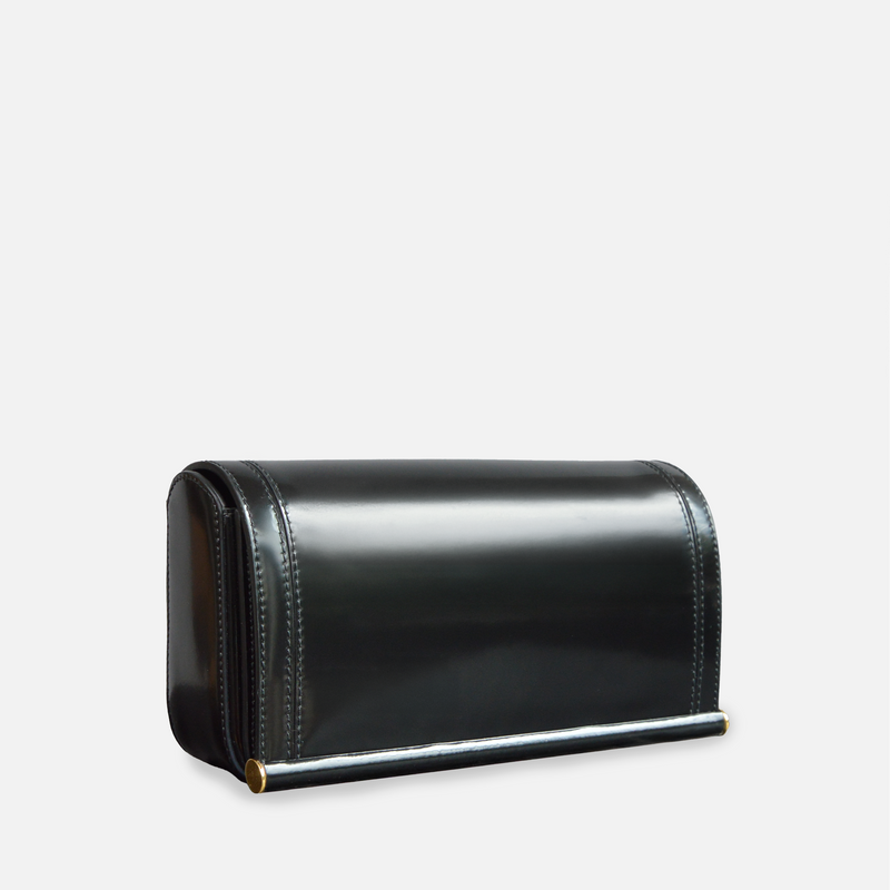 Minimalist luxury evening bag in shiny calfskin leather, featuring Scandinavian design aesthetic.