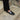 Close-up of luxury handcrafted loafers in black patent leather, handmade Italian leather loafers with a high-end finish.