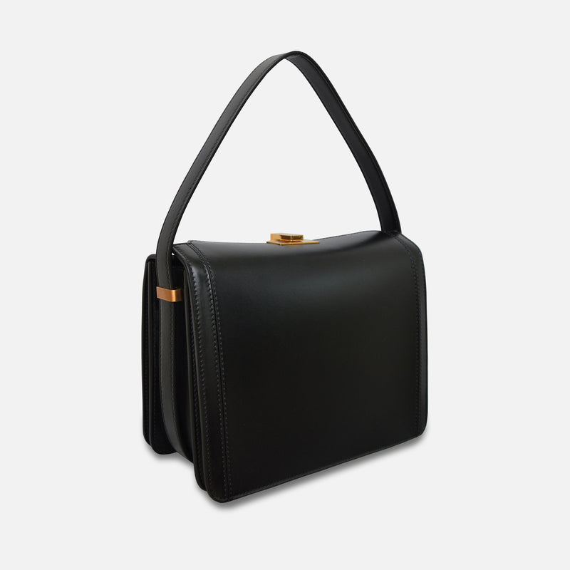 Side View of Susan Szatmáry Petit Palais Black and Gold, 
Ccrossbody bag in a structured box design – Petit Palais by Susan Szatmáry.